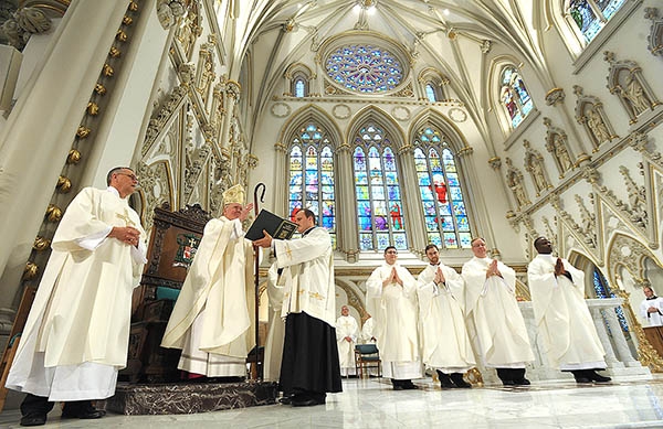 Bishop Richard Malone is all smiles as he says the final blessing to end the Ordination Mass that welcomed Father Cole Webster, Father Luke Uebler, Father Martin Gallagher and Father Robert Agbo to the priesthood at St. Joseph Cathedral June 3. (Dan Cappellazzo/Staff Photographer)